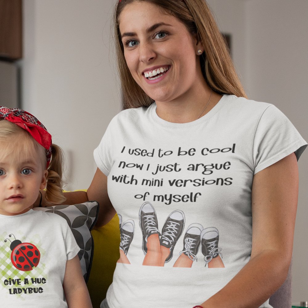 Woman wearing a I used to be cool now I just argue with mini versions of myself t-shirt