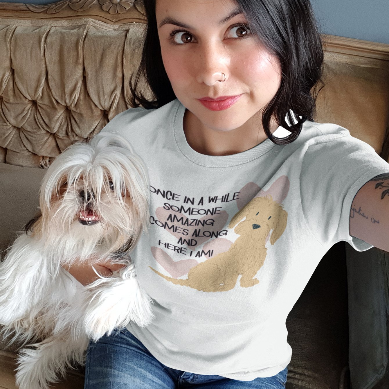 Woman holding a dog wearing a Once in a while someone amazing comes along and here I am t-shirt with a cute dog on it